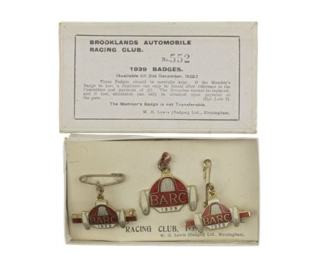 A boxed set of three BARC Brooklands member's and guest's lapel badges, 1938,number 552, in cream and red black enamel, in W 