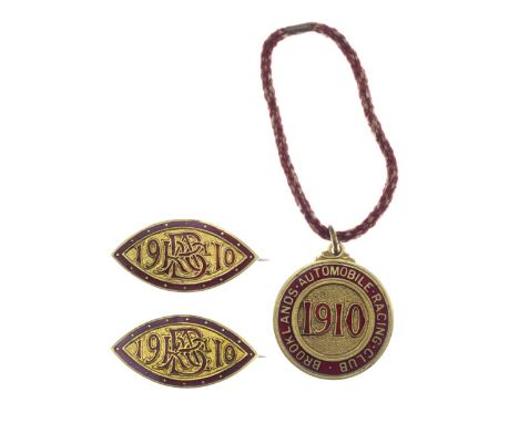 A set of three BARC Brooklands member's and guest's lapel badges, 1910,number 590, red enamel, member's badge with cord. (3)F
