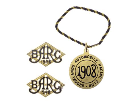 A set of three BARC Brooklands member's and guest's lapel badges, 1908,number 414, black enamel, member's badge with black an