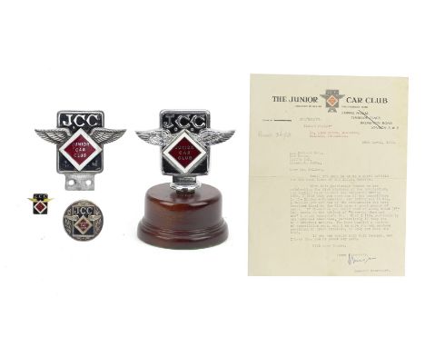 Four Junior Car Club badges,comprising car badge by Elkington, numbered J10014, cast painted metal with enamel 'JCC diamond' 