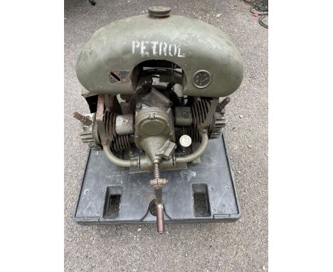 A flat-twin engine mounted as military generator (possibly Douglas),with petrol tank, starter handle and cooling fan, (incomp