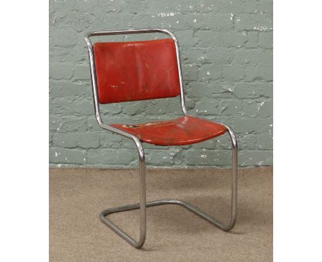 A vintage Pel tubular steel chair with red leather upholstery.