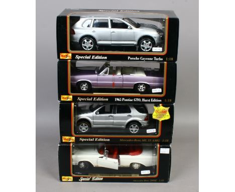 Four boxed Maisto special edition 1/18 scale Diecast model cars including Porsche, Pontica, Mercedes.