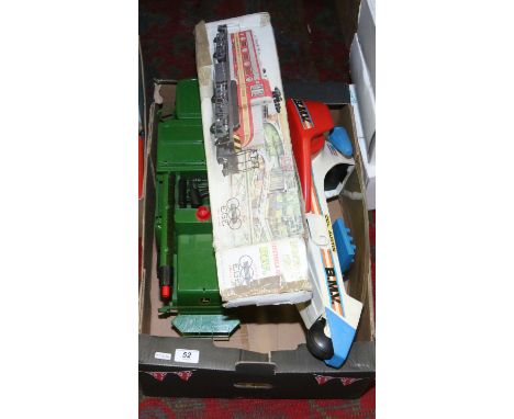 A box of childrens toys to include a model of a John Deere farm vehicle Col. Austin bionic rocket and a diesel locomotora eng