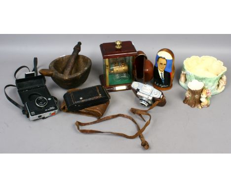 A group of collectables including a glass sculpture of a steam engine, vintage cameras, novelty Political Russian dolls, Sylv