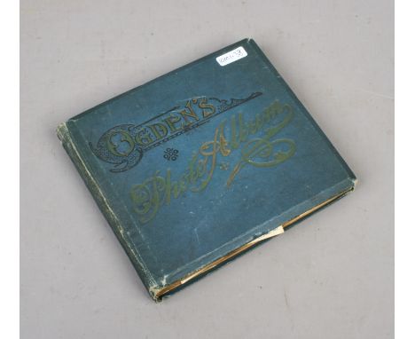A vintage cigarette card album and contents of cards including Players, Wills etc.