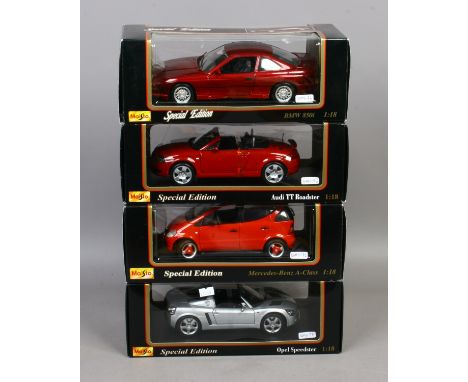 Four boxed Maisto special edition 1/18 scale Diecast model cars including Mercedes, Audi, BMW and Opel.