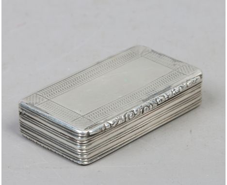 A Georgian silver snuff box having engine turned engraving with reeded decoration, Assayed Birmingham.