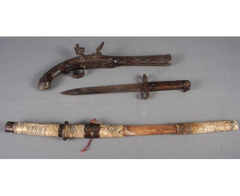 A Japanese Tanto sword with scabbard, 23" long overall, a reproduction flintlock pistol and a WWI bayonetCondition of the pis