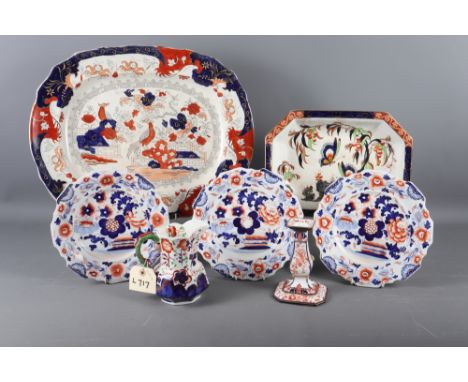 An Imari style platter, a Losolware octagonal dish, three Imari style plates, a Royal Crown Derby Imari candlestick and a sim