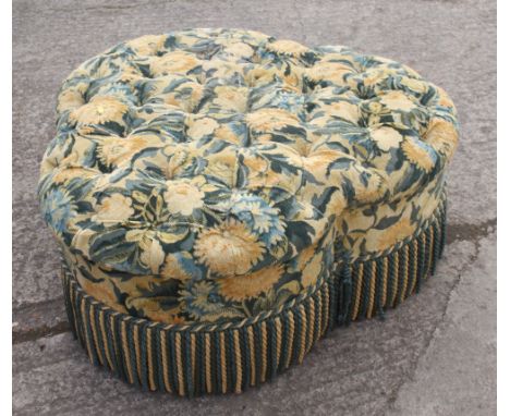 A Peter Dudgeon trefoil ottoman, button upholstered in a floral tapestry, 36" dia x 17" high 