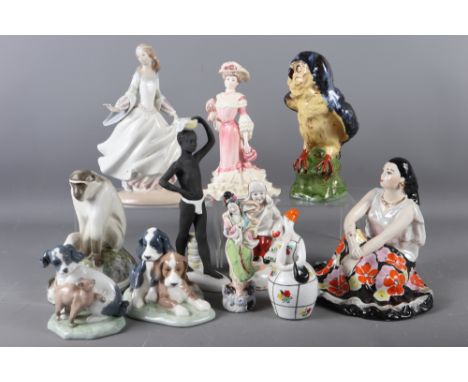 A Lladro figure of a girl, 10" high, two Nao figure groups of dogs and cats, a Golden Age figure, "Georgina", 8 1/4" high, tw