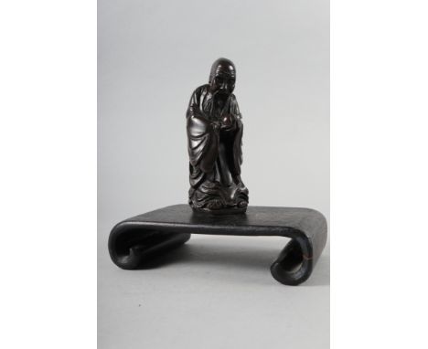 A Chinese bronzed and filled figure of Laotzu, 4 3/4" high, and a hardwood scroll vase stand, 6" wide 