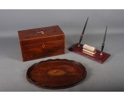 An early 20th century mahogany and banded tea caddy, 10 1/4" wide x 5 3/4" high, an oval gallery tray, 13" wide, and a desk c
