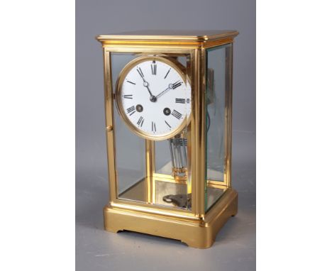 A French brass four-glass mantel clock with striking movement and mercury pendulum by A D Hougin, 10 1/4" high 