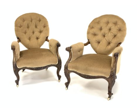 Pair Victorian rosewood upholstered open armchairs, buttoned spoon back, scrolled arm terminals, raised on ceramic castors, W