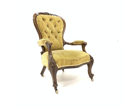 Victorian mahogany open armchair, with leaf carved cresting rail, swept and scrolled arms, raised on leaf carved cabriole sup