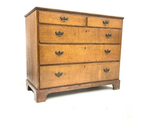 George III oak chest of two short and three long graduated drawers, on replaced pine bracket base, W106cm Condition Report & 