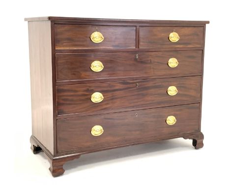 George III crossbanded mahogany chest of two short and three long drawers, with oval plate handles raised on ogee bracket sup