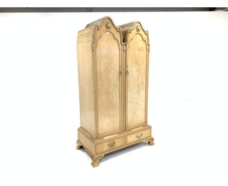 Early 20th century Queen Anne style bleached walnut wardrobe, with two arched panelled doors enclosing hanging rail and and s