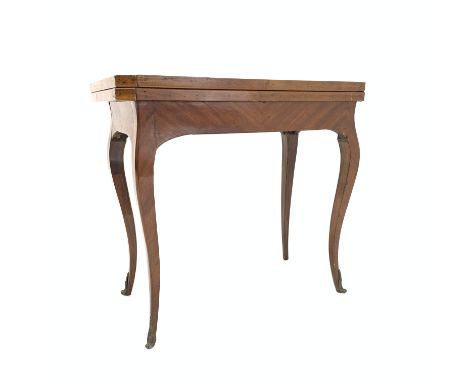 Late 19th century kingwood French style games table, with hinged revolving parquetry top revealing baize lined playing surfac