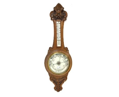 Early 20th century oak cased aneroid wheel barometer and thermometer, with porcelain register and dial, H87cm Condition Repor