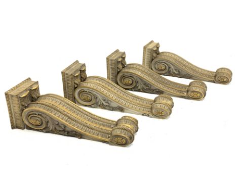 * Two pairs of early Victorian parcel-gilt and white painted architectural brackets each formed as two adjacent scrolling cor