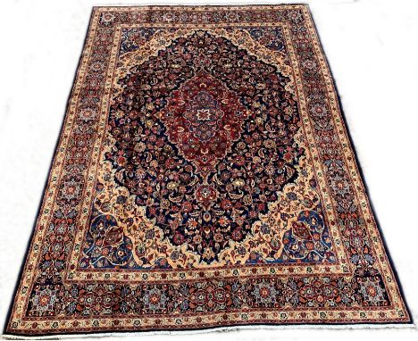 Persian Meshed blue ground carpet, with medallion and interlaced trailing foliate on blue field, floral spandrels, triple gua