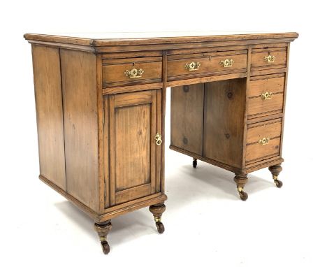 Late Victorian golden pine twin pedestal desk, skivered top over four drawers and a cupboard, incised decoration and brass Go