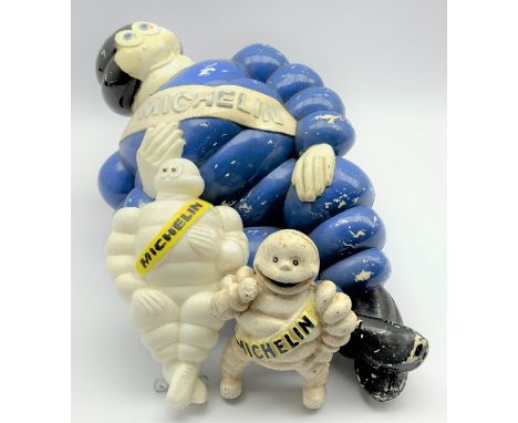 Plastic Michelin man painted in blue, H46cm, a smaller example in white with yellow sash and mounting bracket and a small cas