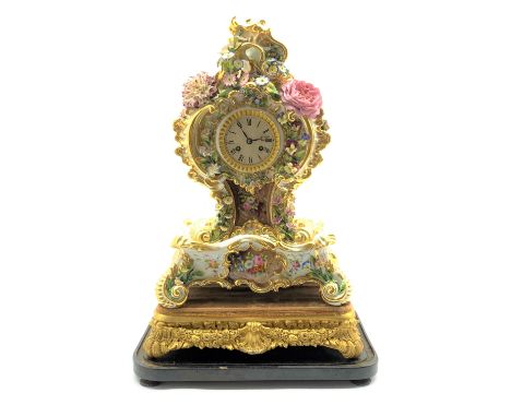 19th century Rococo style porcelain mantel clock, cartouche shaped with hand painted flower head and foliage decoration, on s