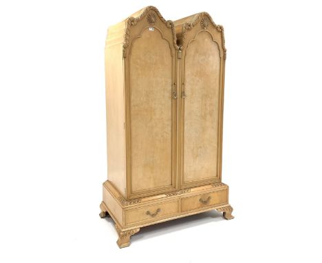 Early 20th century Queen Anne style bleached walnut wardrobe, with two arched panelled doors enclosing hanging rail and and s