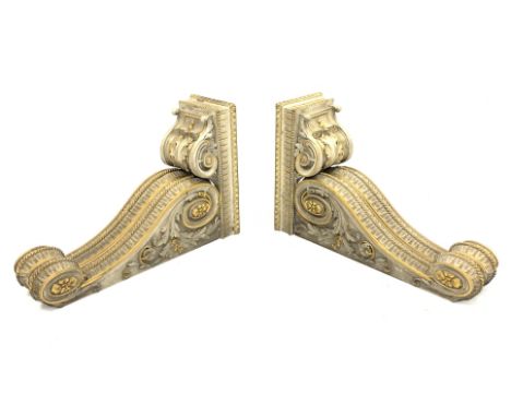 * Pair of early Victorian parcel-gilt and white painted architectural brackets formed as two adjacent scrolling corbels suppo