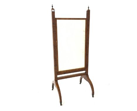 Early 20th century walnut cheval dressing mirror, with urn finials, boxwood and ebonised string inlay, raised on brass cup ca