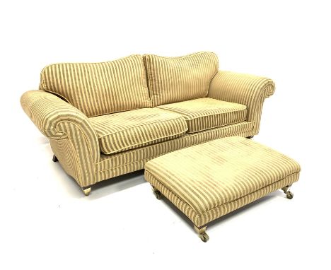 Kirkdale two seat sofa, upholstered in stripped green and yellow fabric, out scrolled arms, raised on tapered mahogany suppor