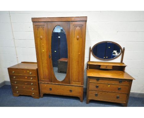 AN EARLY TO MID 20TH CENTURY OAK BEDROOM SUITE, comprising a single mirror door wardrobe, with a single drawer, width 116cm x