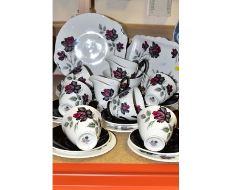 A TWENTY THREE PIECE ROYAL ALBERT MASQUERADE PATTERN TEA SET, comprising a sandwich plate, a cake plate, milk and cream jugs,