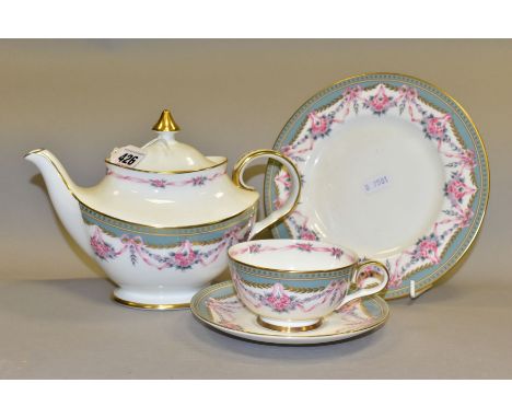 A ROYAL DOULTON TEAPOT AND TRIO, Sutton pattern H5202, comprising a teapot, tea plate, tea cup and saucer, brown printed mark