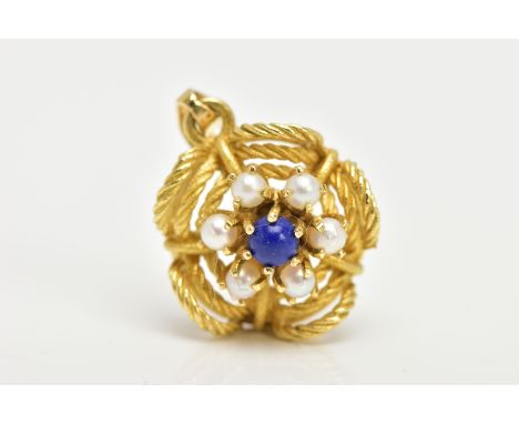 A YELLOW METAL FLORAL GEM SET PENDANT, a lapis lazuli centre surrounded by six seed pearls prong set in a yellow metal mount,