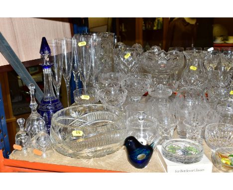 A QUANTITY OF GLASSWARE, MOSTLY CLEAR DRINKING GLASSES, including a Wedgwood Glass bird paperweight, a blue flash liqueur dec