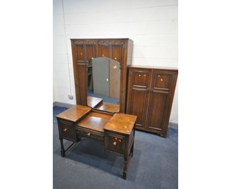 AN EARLY TO MID 20TH CENTURY OAK BEDROOM SUITE, comprising a large double door wardrobe, with key but lock faulty, width 121c