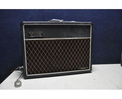 A VOX TRAVELLER GUITAR AMPLIFIER with some damage to carry handle (PAT pass and powers up but audio not checked)