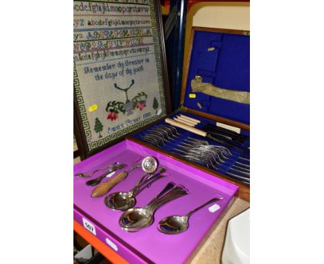 A BOX AND CANTEEN OF CUTLERY, AND A NEEDLEWORK SAMPLER, to include a wooden canteen of twenty two pieces of cutlery by Frank 