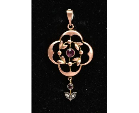 AN EARLY 20TH CENTURY FLORAL PENDANT, a circular cut amethyst in a milgrain setting, central to an openwork floral design in 