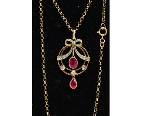 A MODERN 9CT GOLD RUBY AND DIAMOND PENDANT NECKLACE, openwork circular pendant with a diamond detailed bow and three flowers,