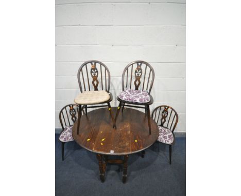 AN OAK BARLEY TWIST GATE LEG TABLE, open length 121cm x closed length 42cm x depth 92cm x height 74cm and four Ercol Prince o