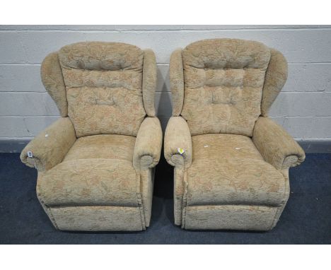 A PAIR OF FLORAL BIEGE UPHOLSTERED MANUAL RECLINING ARMCHAIRS