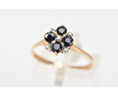 A 9CT GOLD SAPPHIRE AND DIAMOND RING, four circular cut blue sapphires set with five round brilliant cut diamonds, set in yel