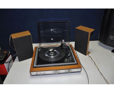 A VINTAGE BUSH A1005 RECORD PLAYER and a pair of speakers (PAT fail due to uninsulated plug but working) knob for on off swit