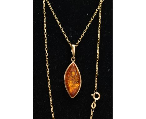 A 9CT GOLD AMBER PENDANT NECKLACE, lozenge shape amber cabochon, set within a gold mount, fitted with a tapered bail hallmark